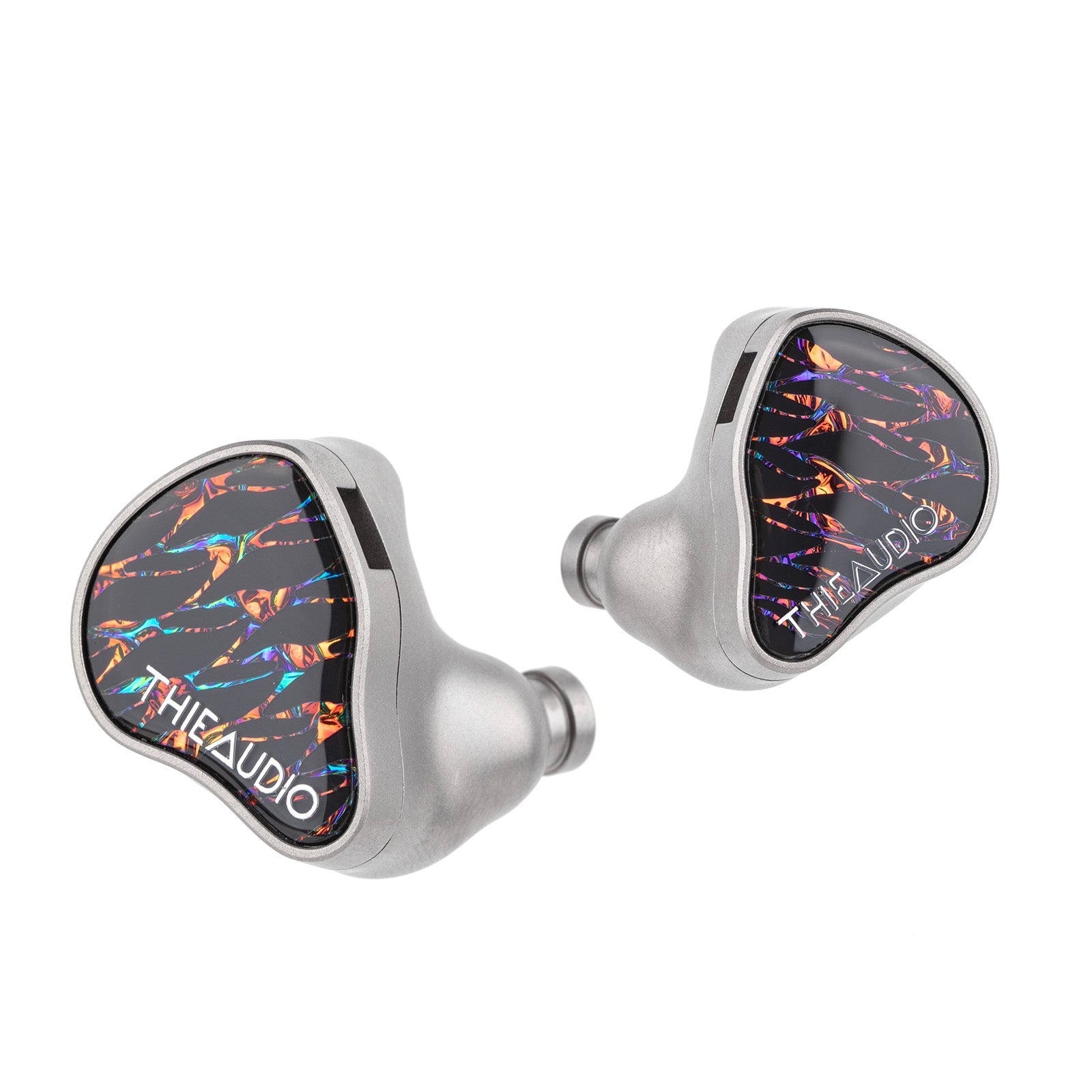 Both Thieaudio Valhalla shells at an angle, faceplates toward the camera, one turned to show its nozzle