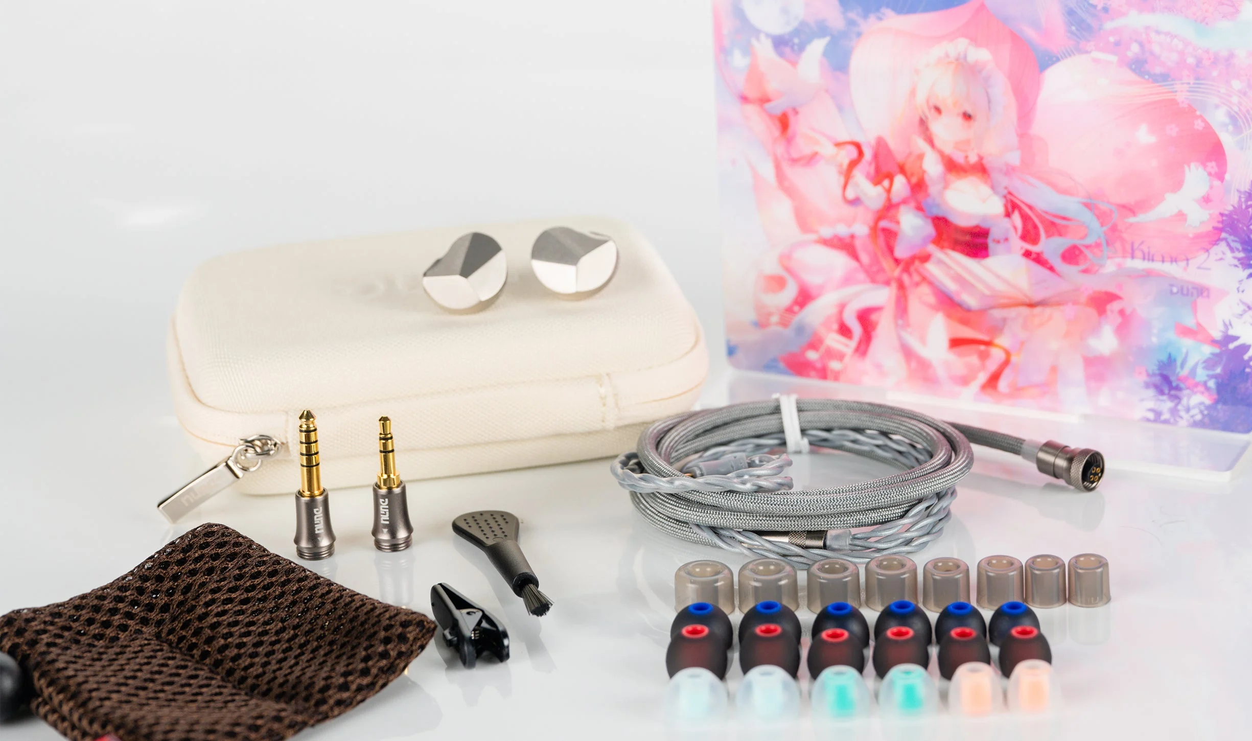 DUNU Kima 2 product image showing the cable and accessories layout